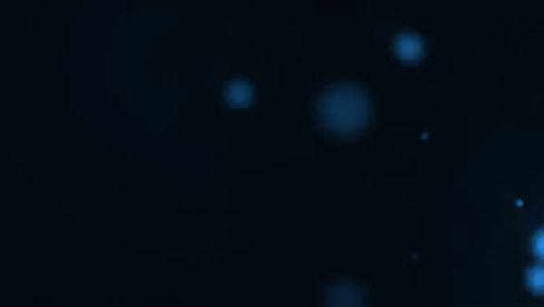 Dark image with blue dots on