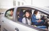Five youngsters using a car pooling service