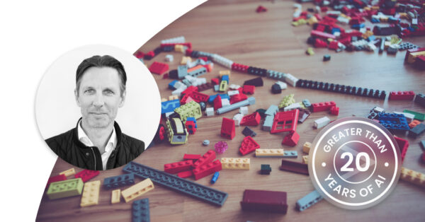 Toy blocks pieces in different colours and shapes on a table. Profile image of Anders Lindelöf.