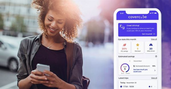 Woman looking at her phone, phone is showing Covercübe app