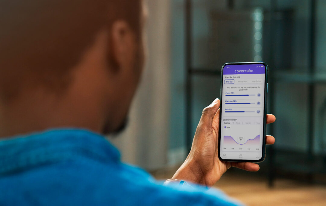 Person holding phone looking at the Covercube app