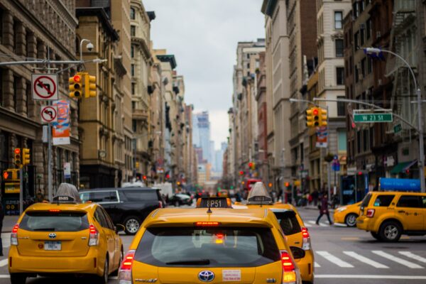 Yellow taxi cars driving on a street