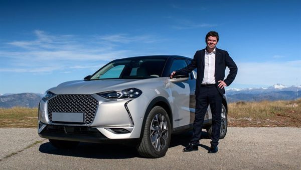 FIA Smart Driving Challenge winner 2020 is posing next to his car