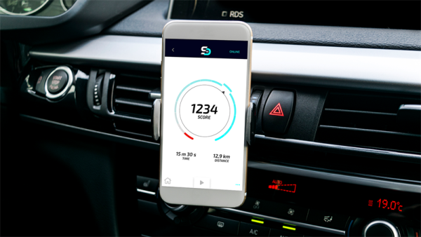 Fia smart driving challenge app showing the drivers score on a phone in a car.