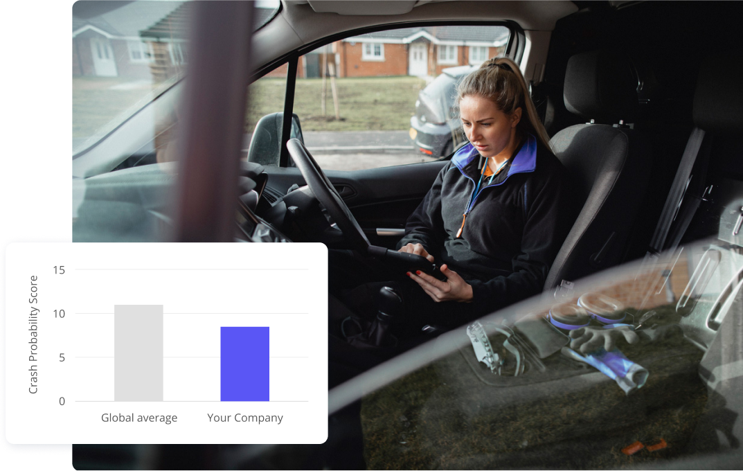 Woman sitting in a car looking at driver statistics on a tabletv