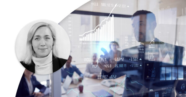 People working in a conference room looking at diagrams. Profile image of Johanna Forseke.
