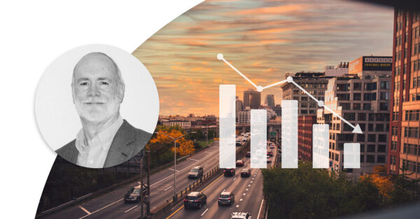 Profile image of Jim Noble in the corner. In the background there is a highway with cars driving in the dusk. White diagram on top to illustrate that loss ratio is going down.