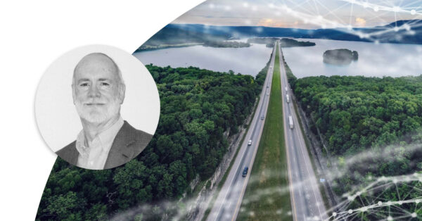 Road going between green islands. Profile image of Jim Noble.