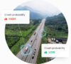 Aerial view of vehicles traveling on a divided highway through green terrain, overlaid with icons showing 