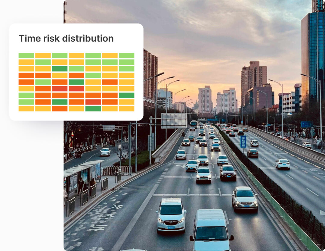 Cars driving on a highway with skyscrapers in the background. Module on the side is showing time risk distribution