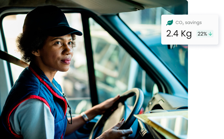 Woman driving a delivery van seeing CO2 savings in Kg