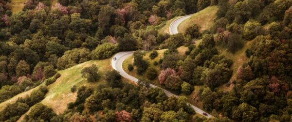 Car driving on a twisting road in the nature