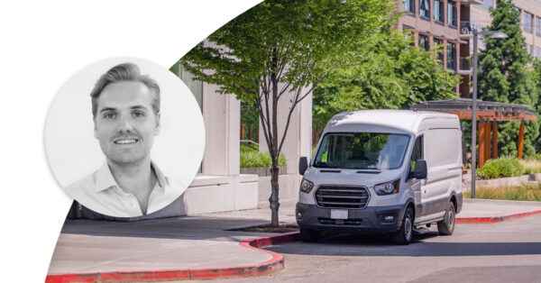 Delivery truck parked by the side of the road on a street with green trees. Profile image of Johan Forseke.