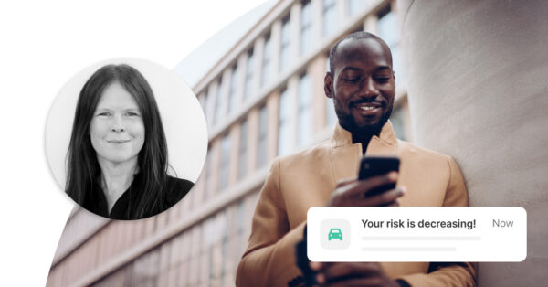 A dynamic scene showing Liselott Johansson alongside a smiling driver receiving positive in-app feedback, illustrating how Greater Than predicts and reinforces safer driving behavior with real-time risk insights.