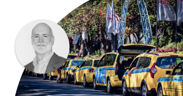 Yellow taxi cars parked on the street. Profile image of Jim Noble